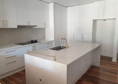 Kitchen newly built with white cabinets