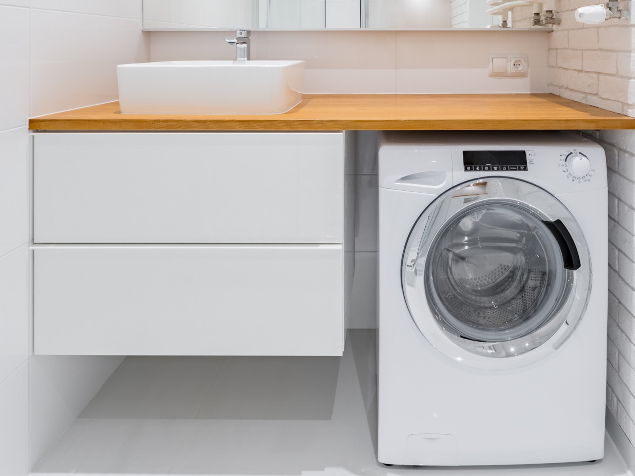 countertop basin with 2 white drawers and a wooden benchtop